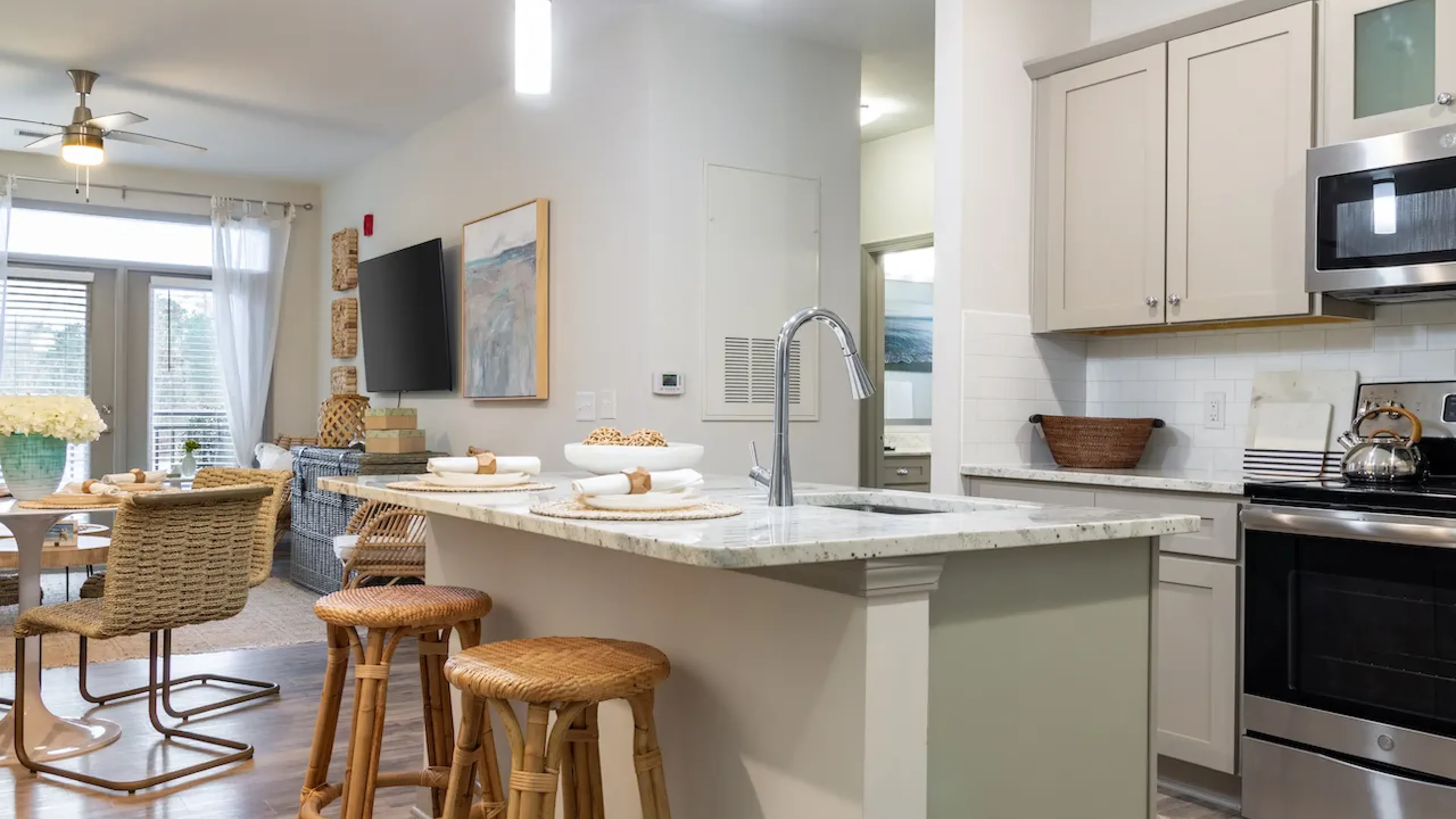 Hawthorne at Smith Creek apartment kitchen with quartz countertops, stainless steel appliances, and ample cabinet storage