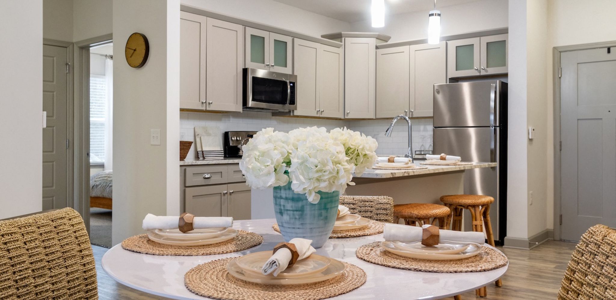 Hawthorne at Smith Creekapartment living room with large patio doors, furnished with a couch, coffee table, and chair